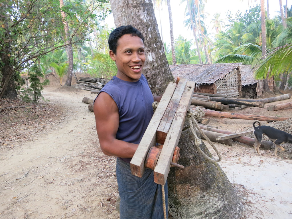 Proudly presenting a handmade winch to lift up the heavy wooden poles.