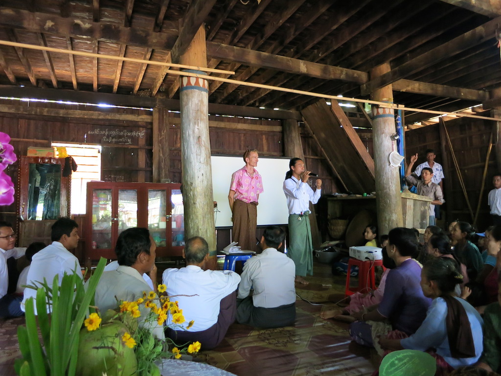 The monk teaches a Buddhist lecture and gives us time to share our information with the villagers and attend to their questions.